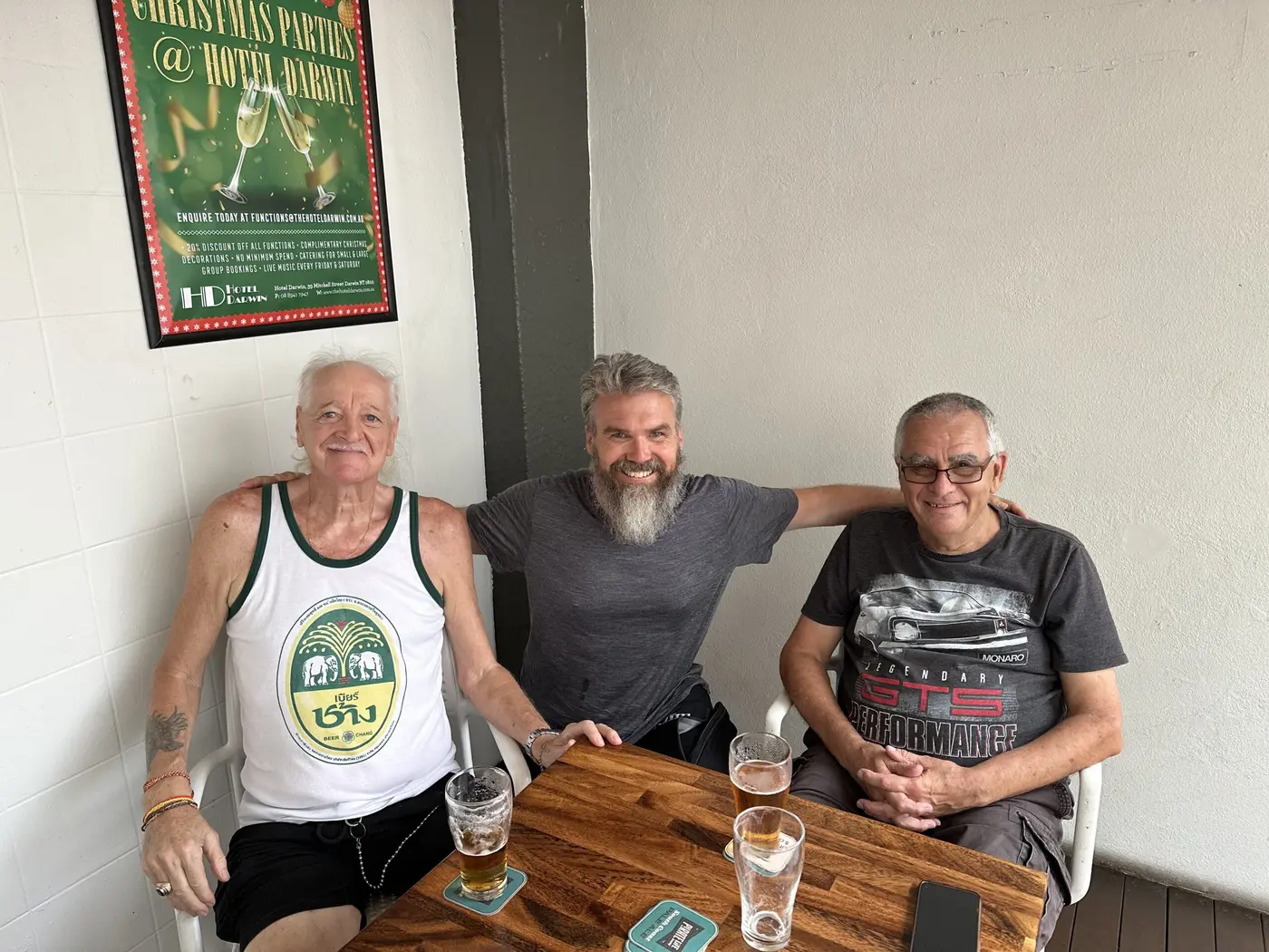 Sharing a drink with two hospitable locals in a Darwin bar.