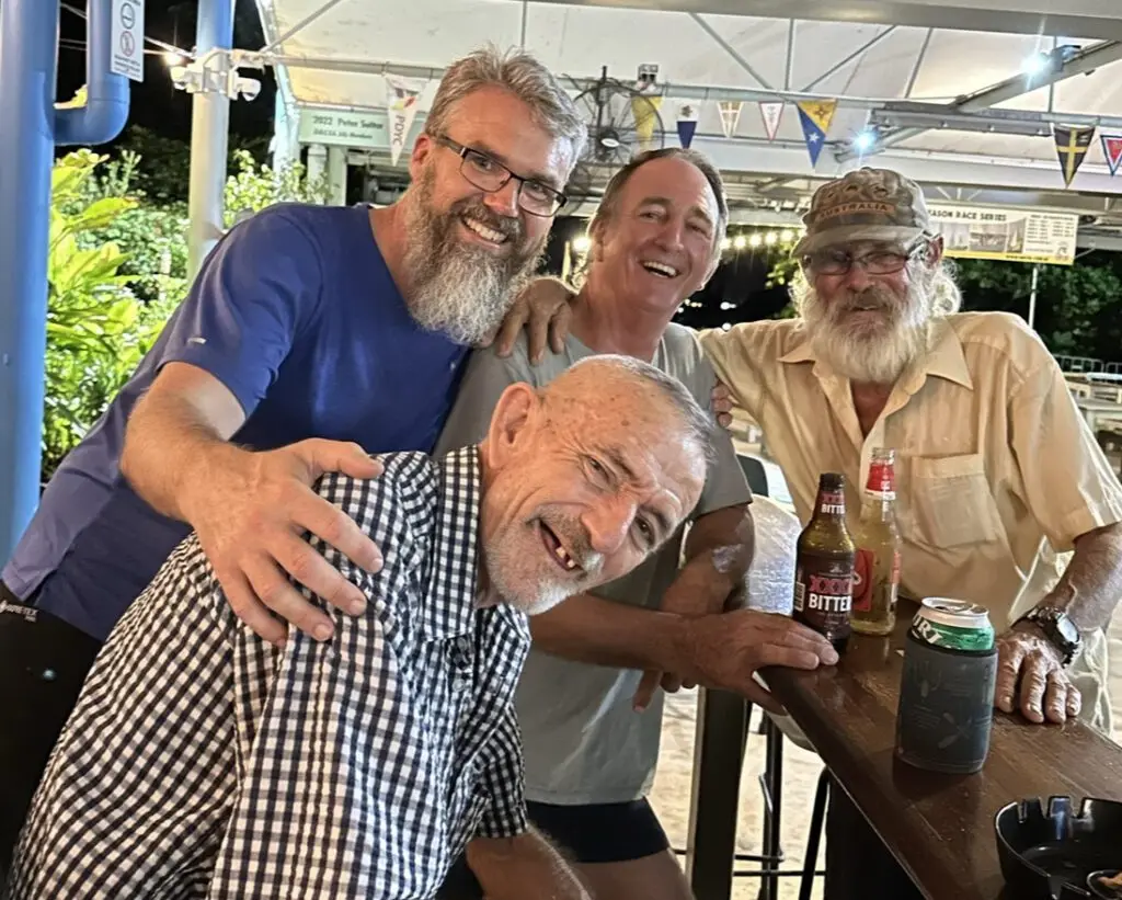 A group of Darwin locals in a warm embrace, welcoming the traveller.