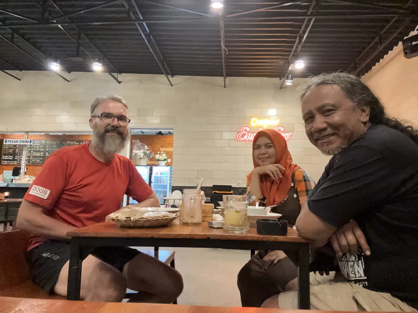Dinner shared with Indonesian hosts around a restaurant table.
