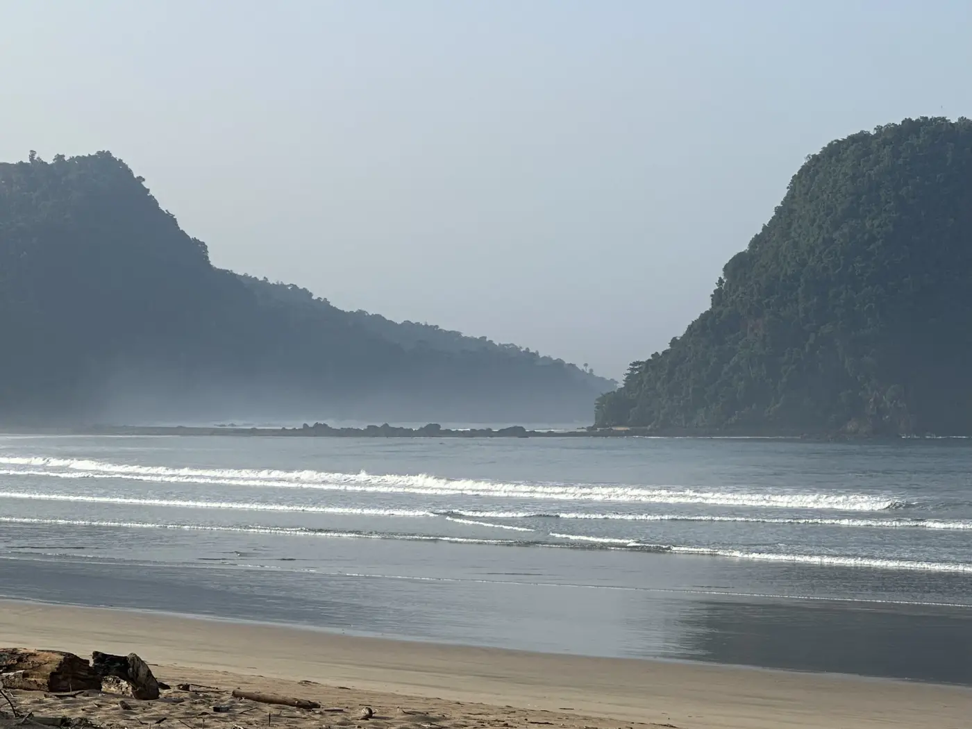 Grey morning surf rolling onto Red Island Beach.